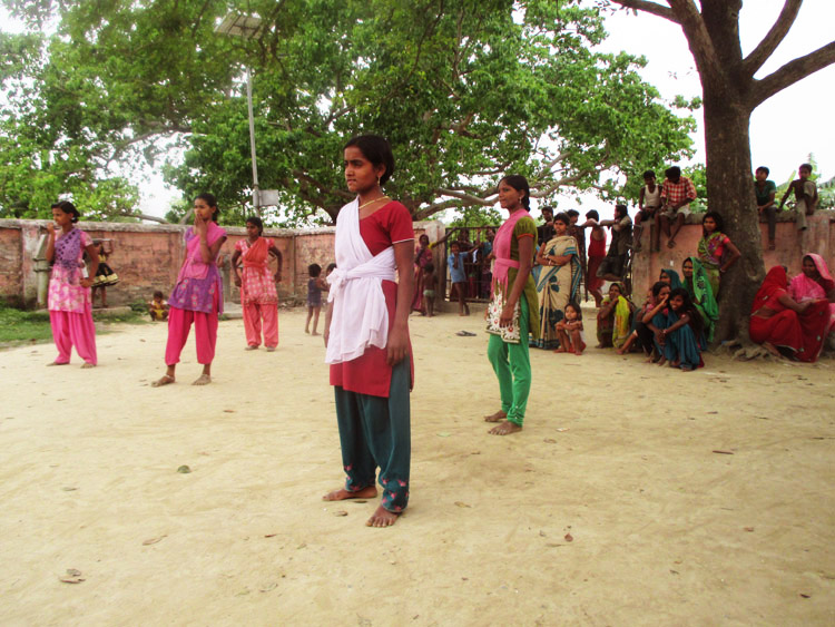 The fierce and determined Kishori’s of Sonvari village stand in position for the match to begin (Photo: SPS-Leher team)