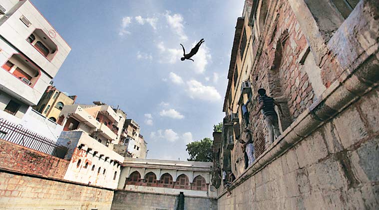 A boy jumps into a baoli at Nizamuddin Dargah in Delhi (Photo: Ravi Kanojia)
