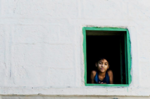 A child looking through a window