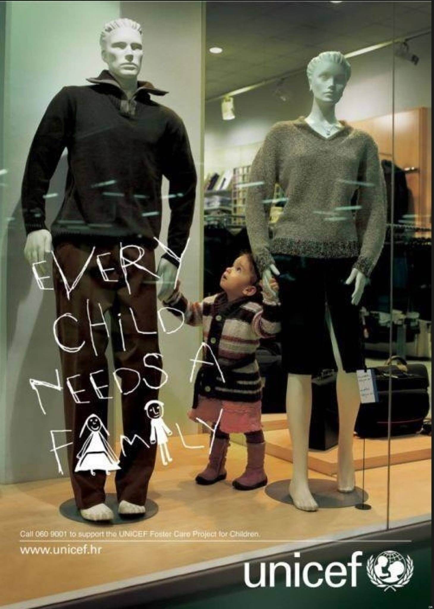 Poster by UNICEF - A child holding hands of 2 mannequins 