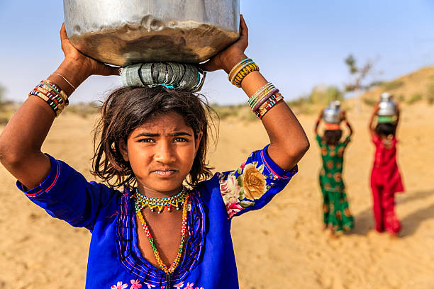 Adolescent Girl carrying a water pot - Leher NGO in India | Child Rights Organization
