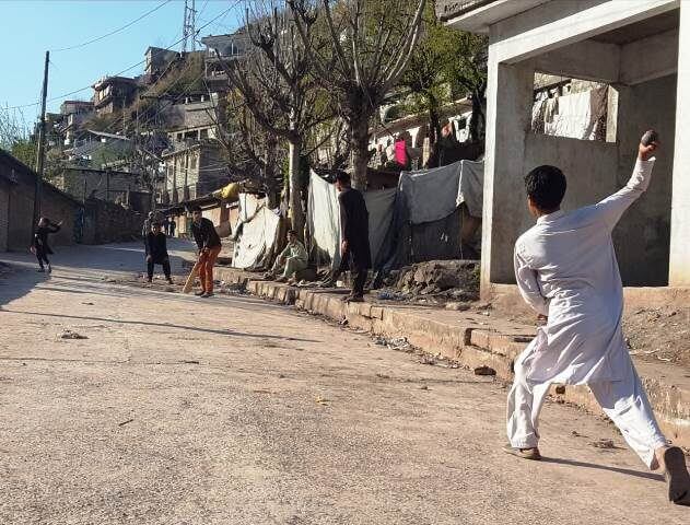 Refugee Camps - Children playing cricket