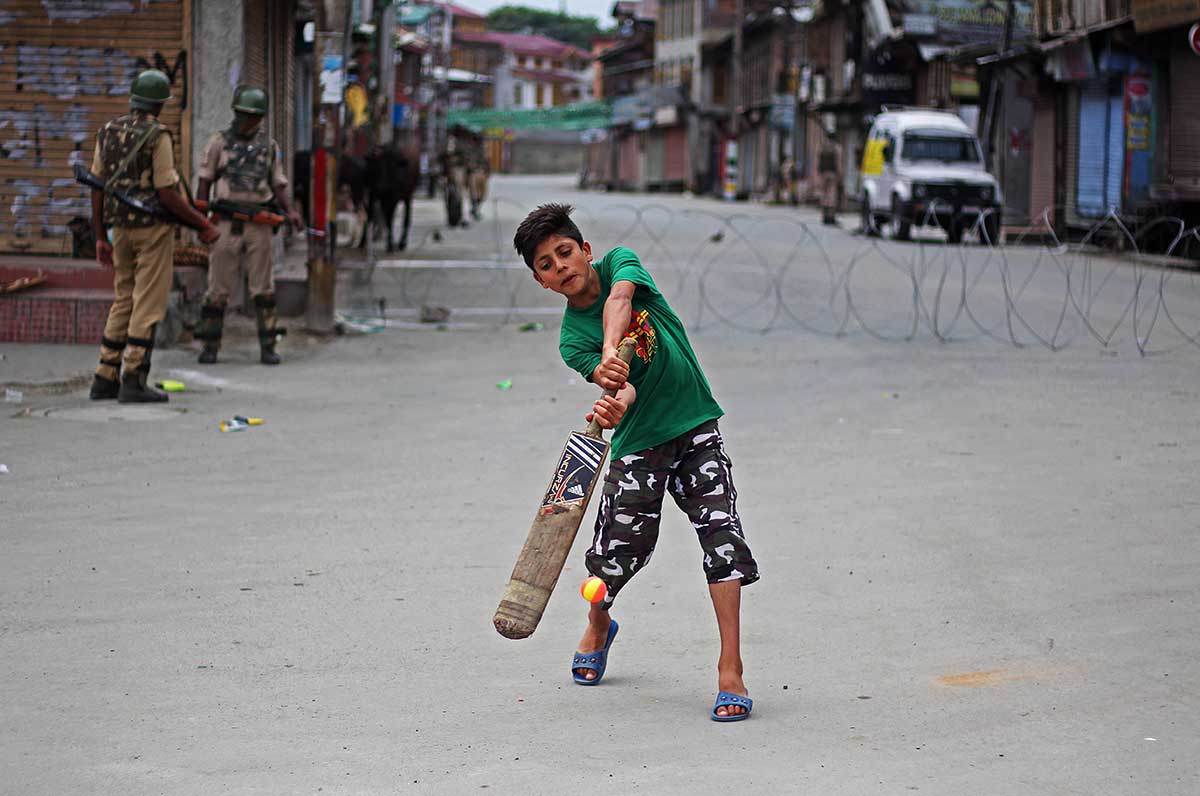Children playing cricket in a shutdown