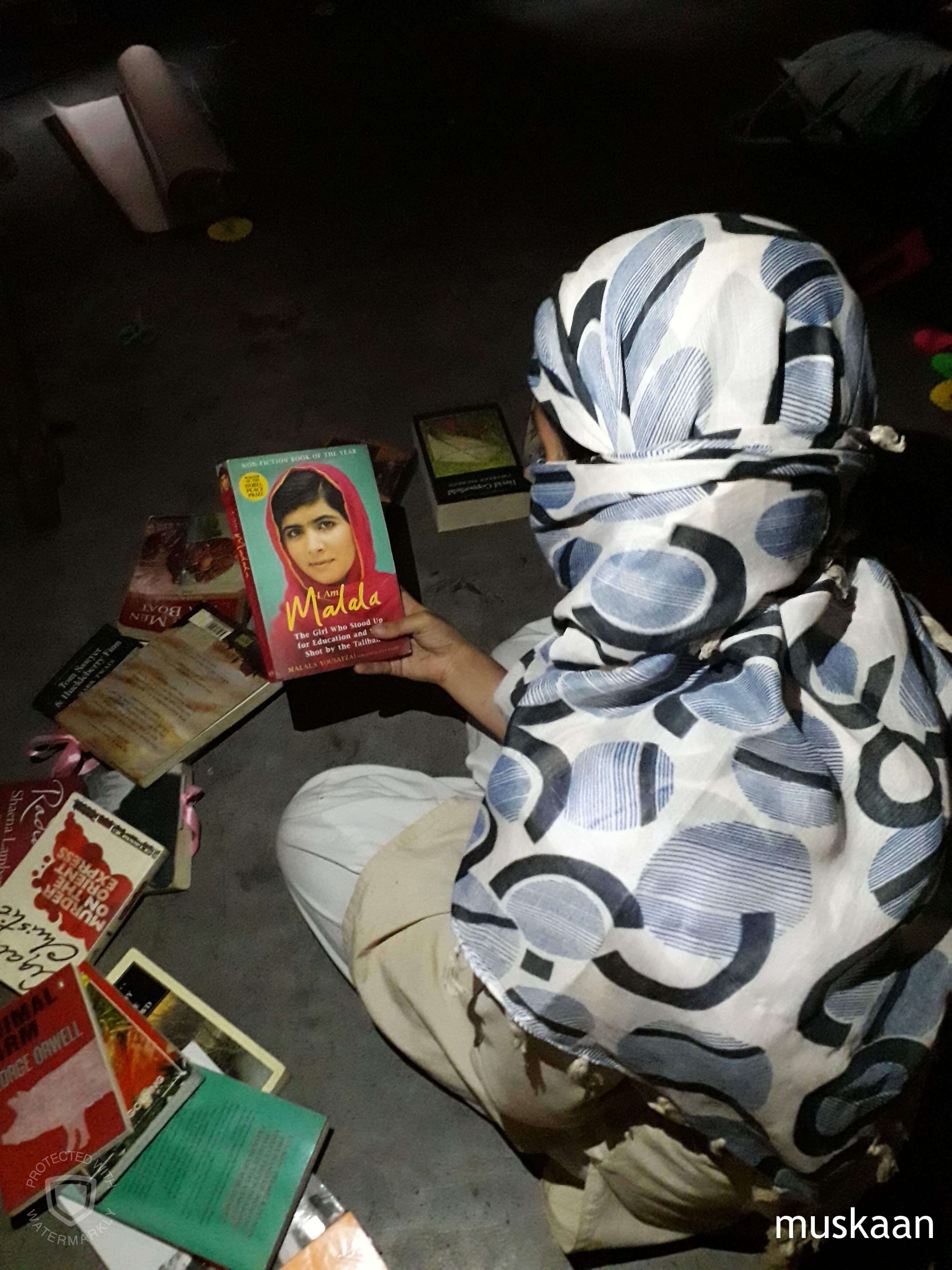 Malala's book held by a child