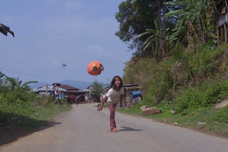 One of the daughters playing ball