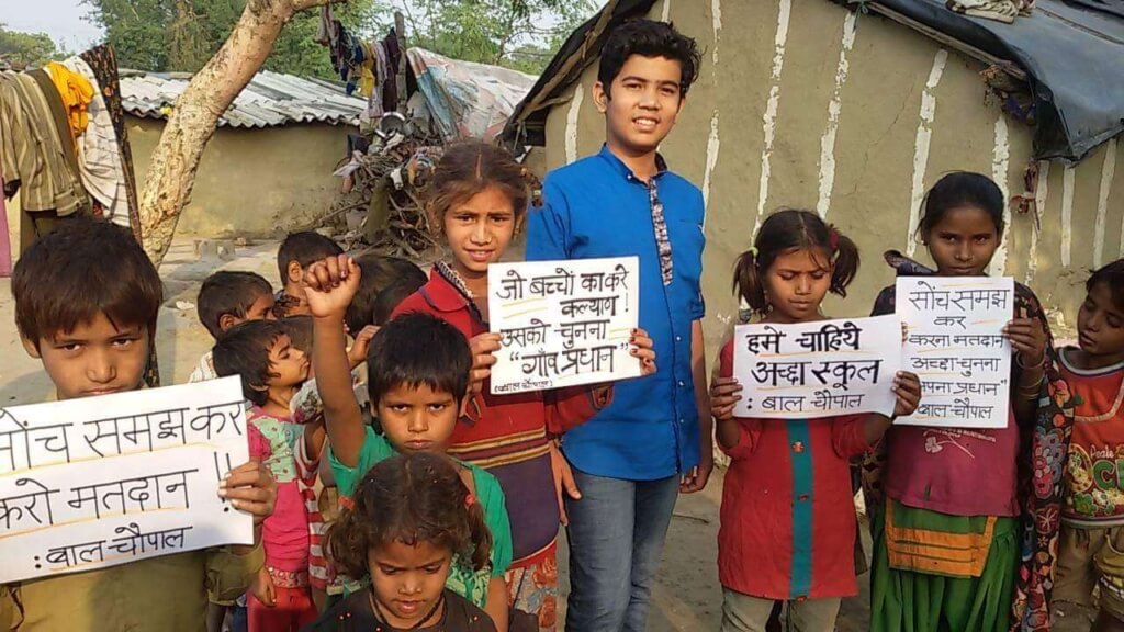 Children holding placards related to education
