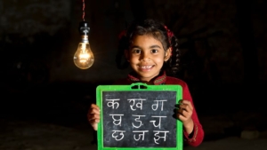 A child learns to write Marathi. This is a picture that depicts Education