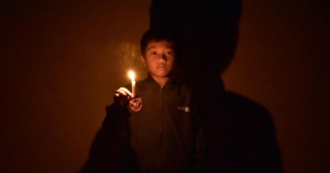 A child holding a candle